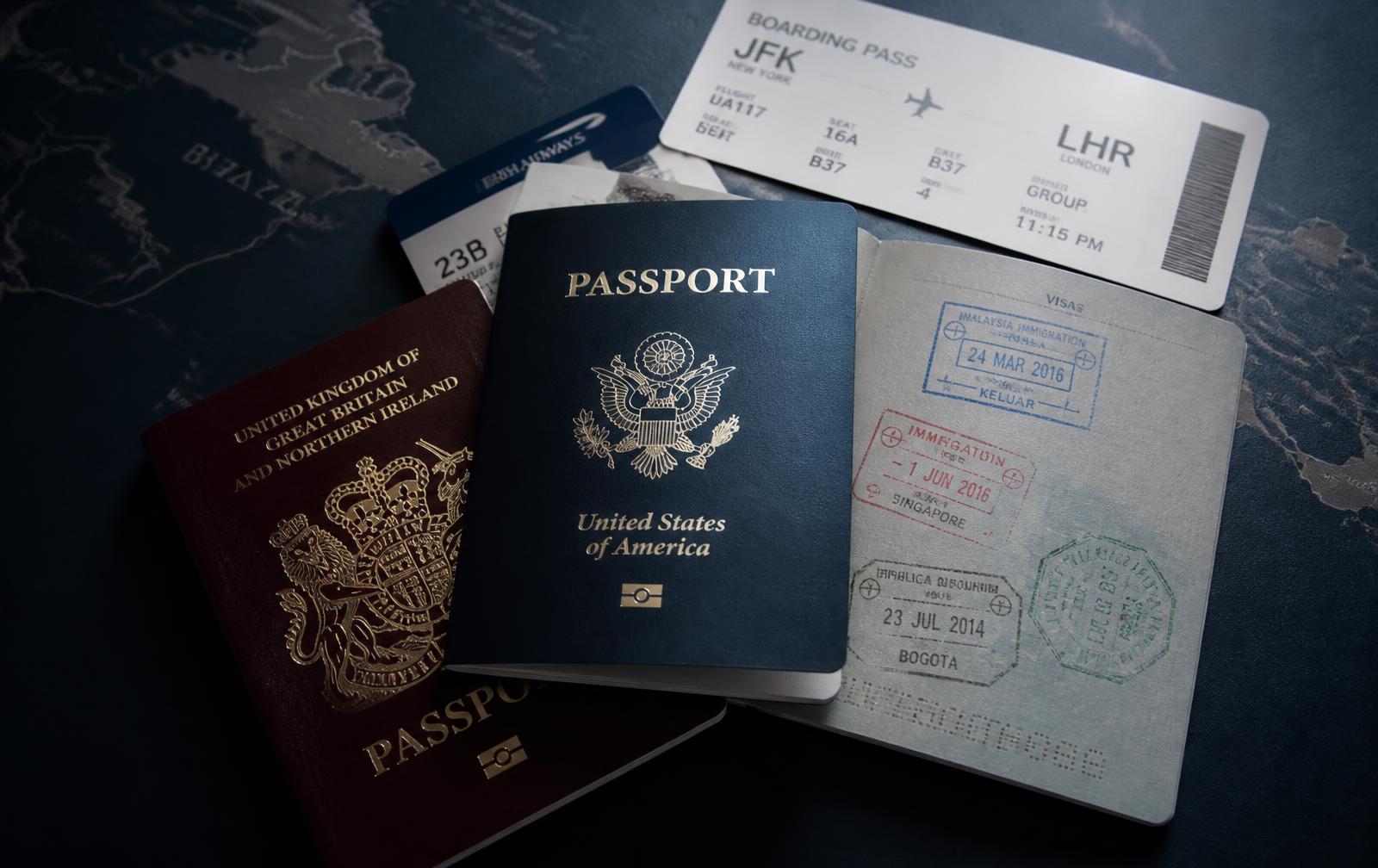 Passports, boarding passes and visa stamps on a desk